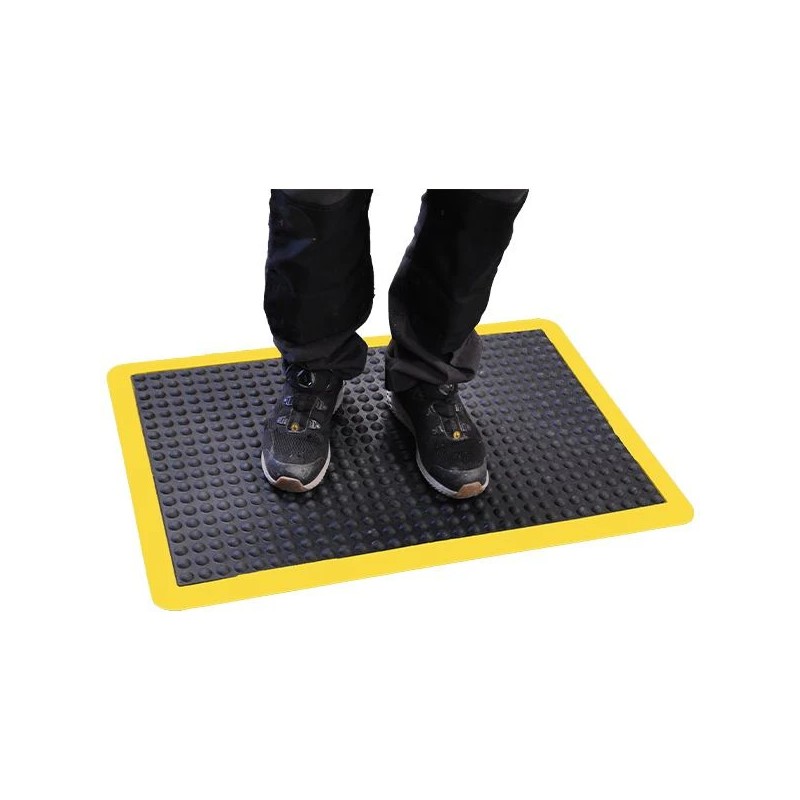 Tapis anti-fatigue ergonomique pour poste de travail debout. Améliore le confort, réduit la fatigue et favorise la circulation s